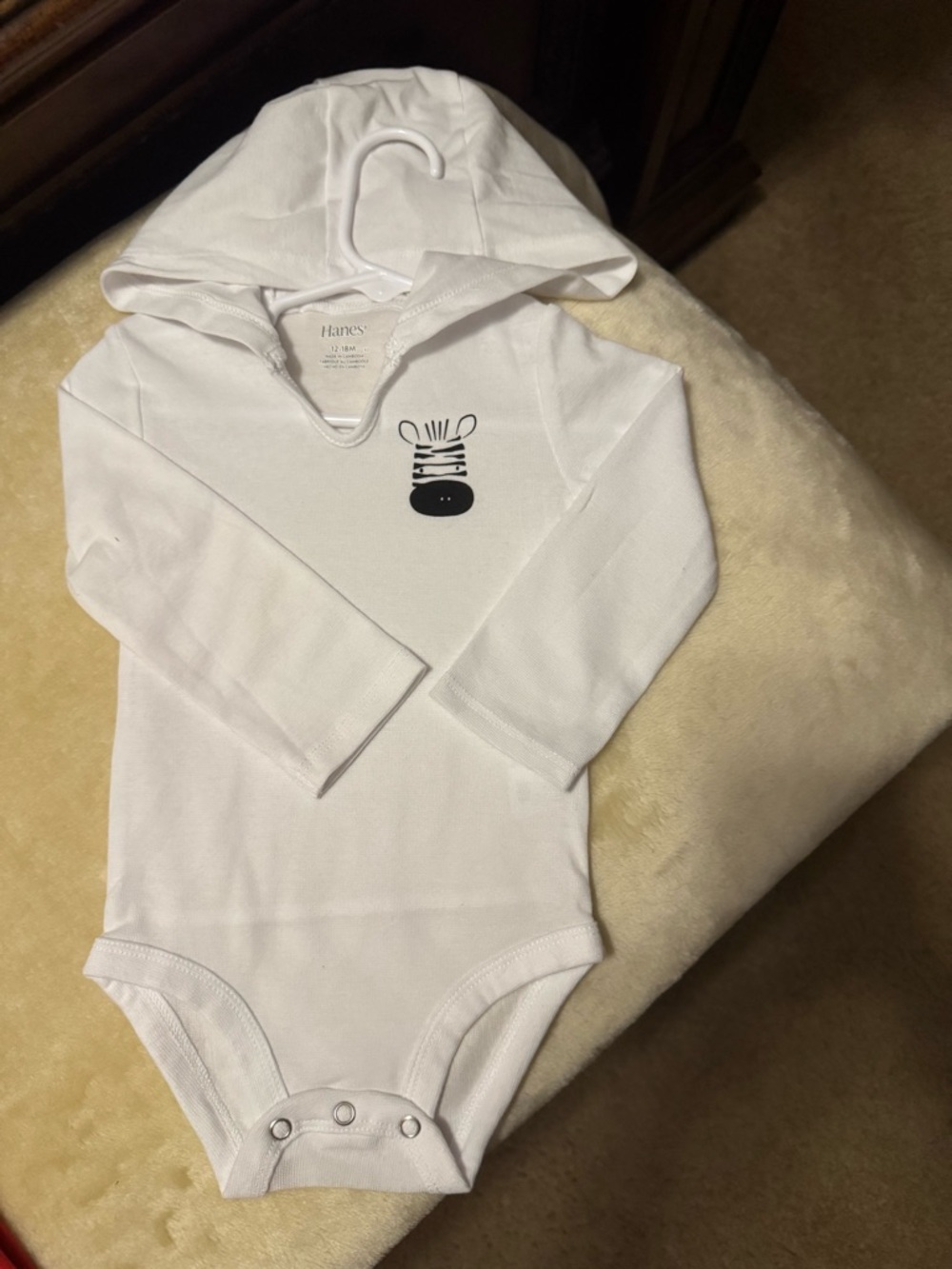 Hanes White, Black, and Zebra Graphic Hooded Baby Bodysuit.